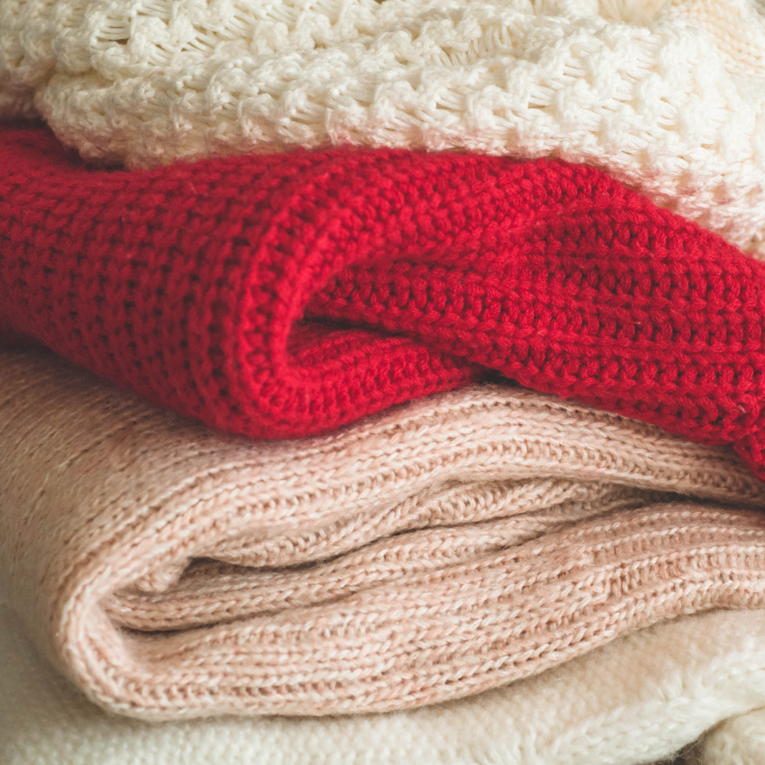 A stack of knitted sweaters in the interior of the living room